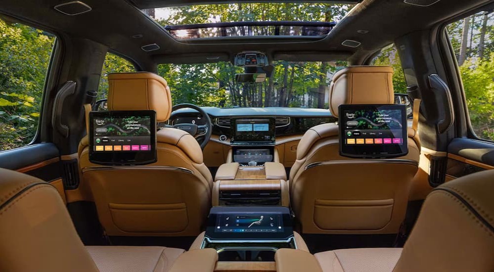 Tan interior, black dash, and infotainment displays in a 2027 Jeep Grand Wagoneer.