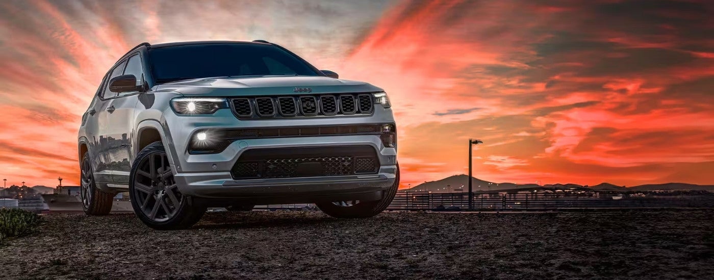 Silver 2025 Jeep Compass parked off-road