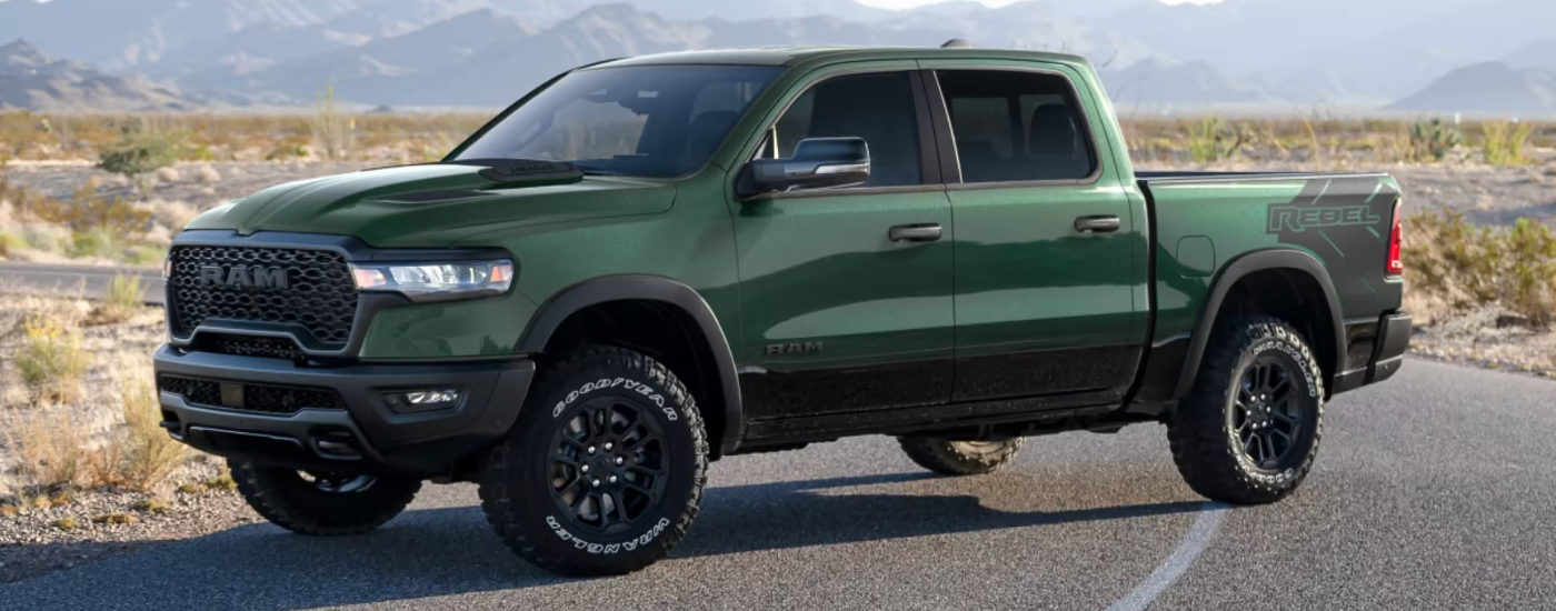 Green 2025 Ram 1500 Rebel parked at an angle