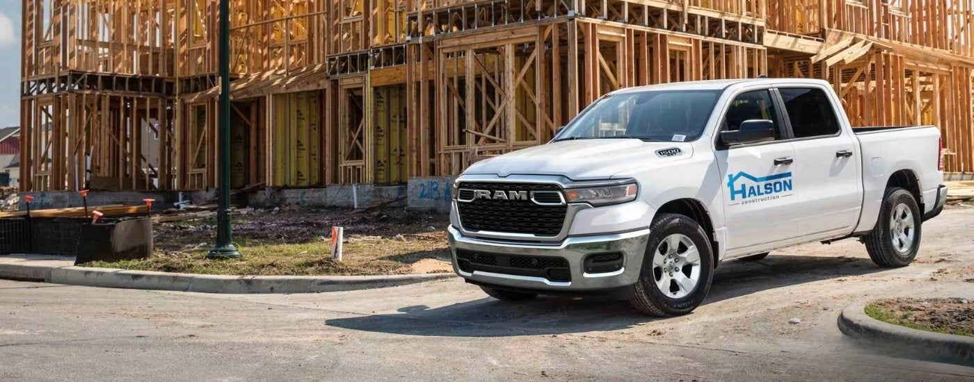 White 20255 Ram 1500 Big Horn at a construction site