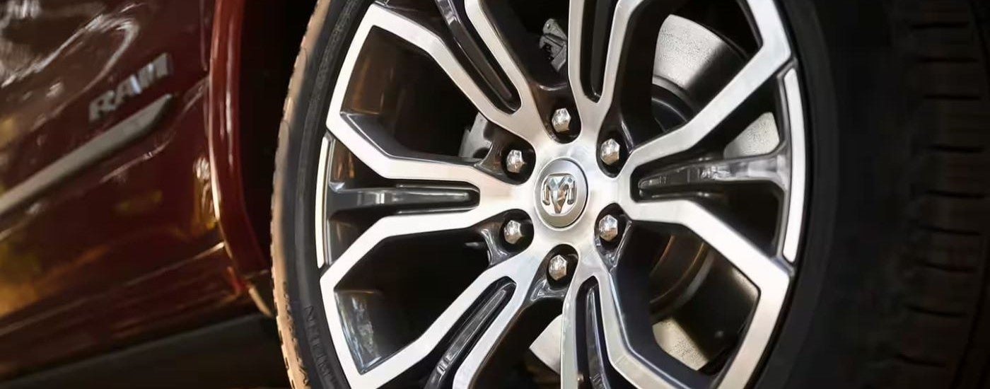 Rim and tire on a red 2025 Ram 1500