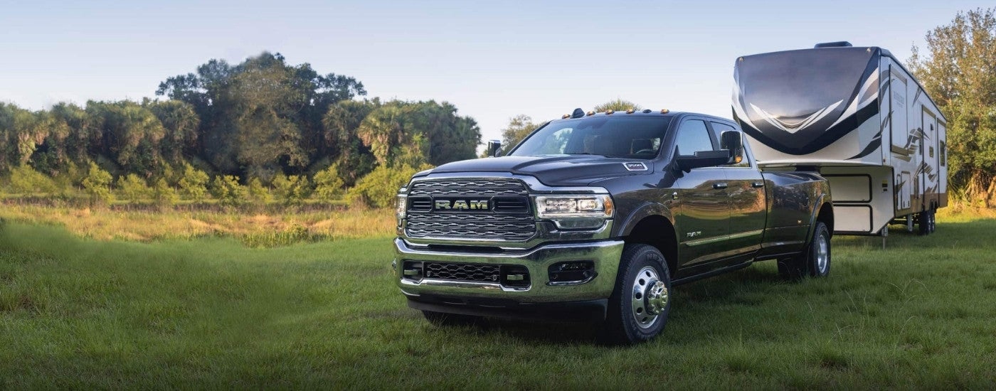 Grey 2022 Ram 3500 parked on a field after visiting Ram dealer near Farmington