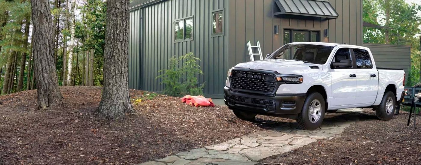 White 2026 Ram 1500 Tradesman parked near a building